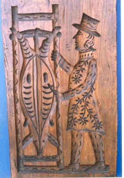 De_slacht__verwerkt_op_een_historische_koekplank